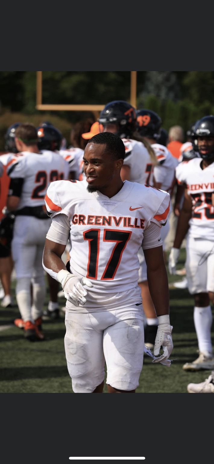 Coach Jalen Dowell wearing number 17 for Greenville University